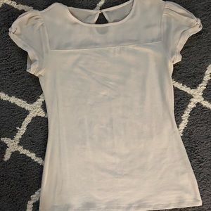 Express cream colored top with sheer neck line
